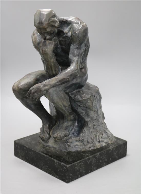 A bronze of a kneeling gentleman,The Thinker, signed A. Rodin, on marble base, height 40.5cm